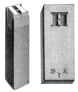 A punch (left) and the respective matrix produced from it (right). The small letters at the base of the matrix are founders marks.