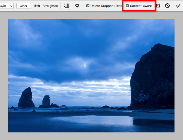 Content-Aware option for the Crop tool fills in empty areas for rotated image.