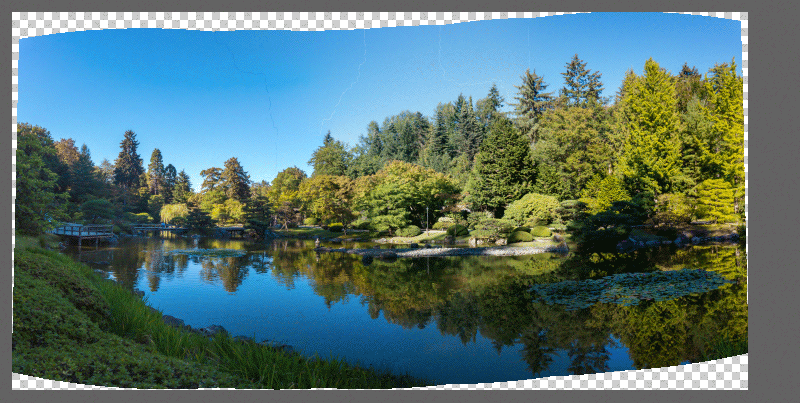Animation demonstrating merged panorama comparing Content Aware Fill Transparent Areas option off and on.