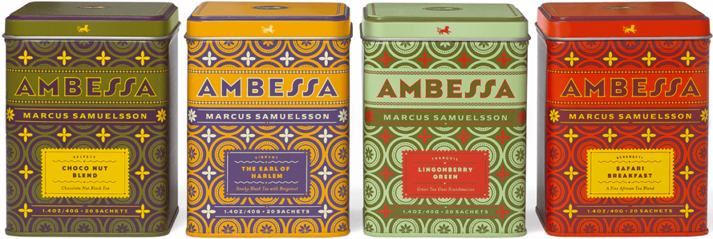 Four tea tins with handlettered labels