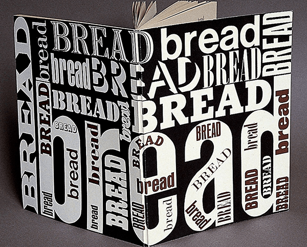 Hardback book covered in the word "bread" in bold black and white text