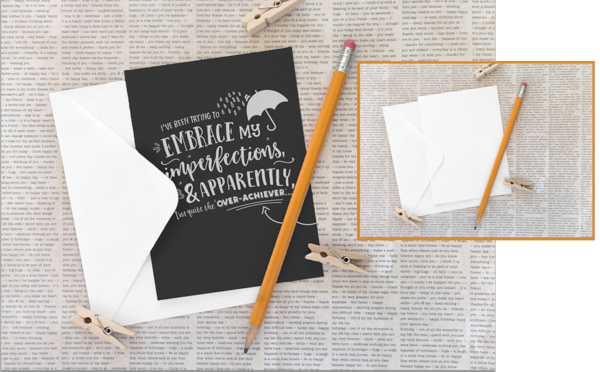 Greeting card with envelope on imitation newspaper background with pencil and clothespins. Card says "I've been trying to embrace my imperfections and apparently, I'm quite the 'over-achiever'..."