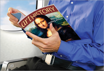 Detail of image of passenger reading magazine, with new Art History cover with Mona Lisa replacing previous version