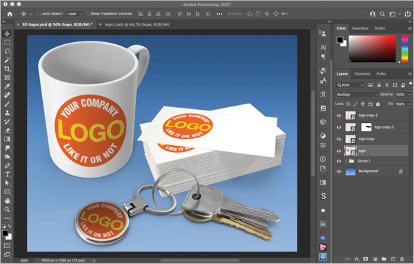 Image of cup, business cards, and keychain with new variant of logo with red circle and white/yellow text