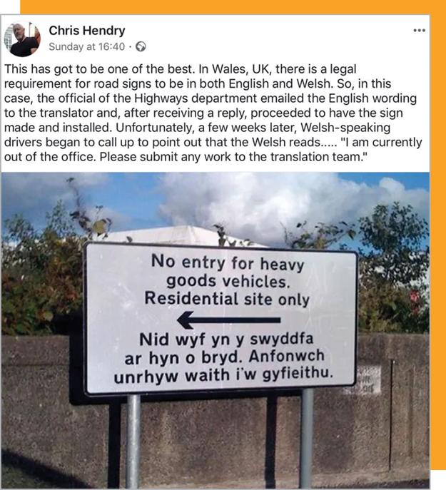 Road sign showing English and a Welsh text that is not a translation