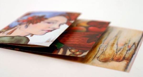Color brochure laying flat with three tiers of folds, with each successive panel extending to the right beyond the previous one about three inches.